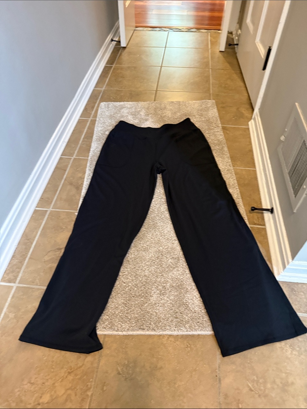 Women’s black athletic Wide-Leg Pants with pockets.